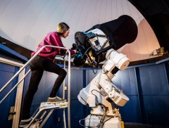 Undergraduate Student Tiffany Fields with the Telescope